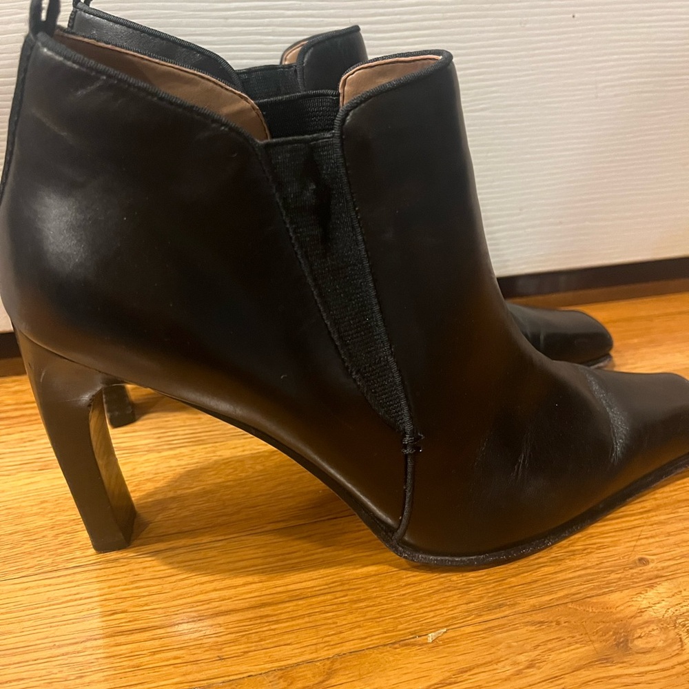 Black Leather Boots with curved heel.